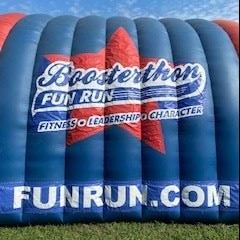 Large red and blue tunnel with Boosterthon logo on the side. 