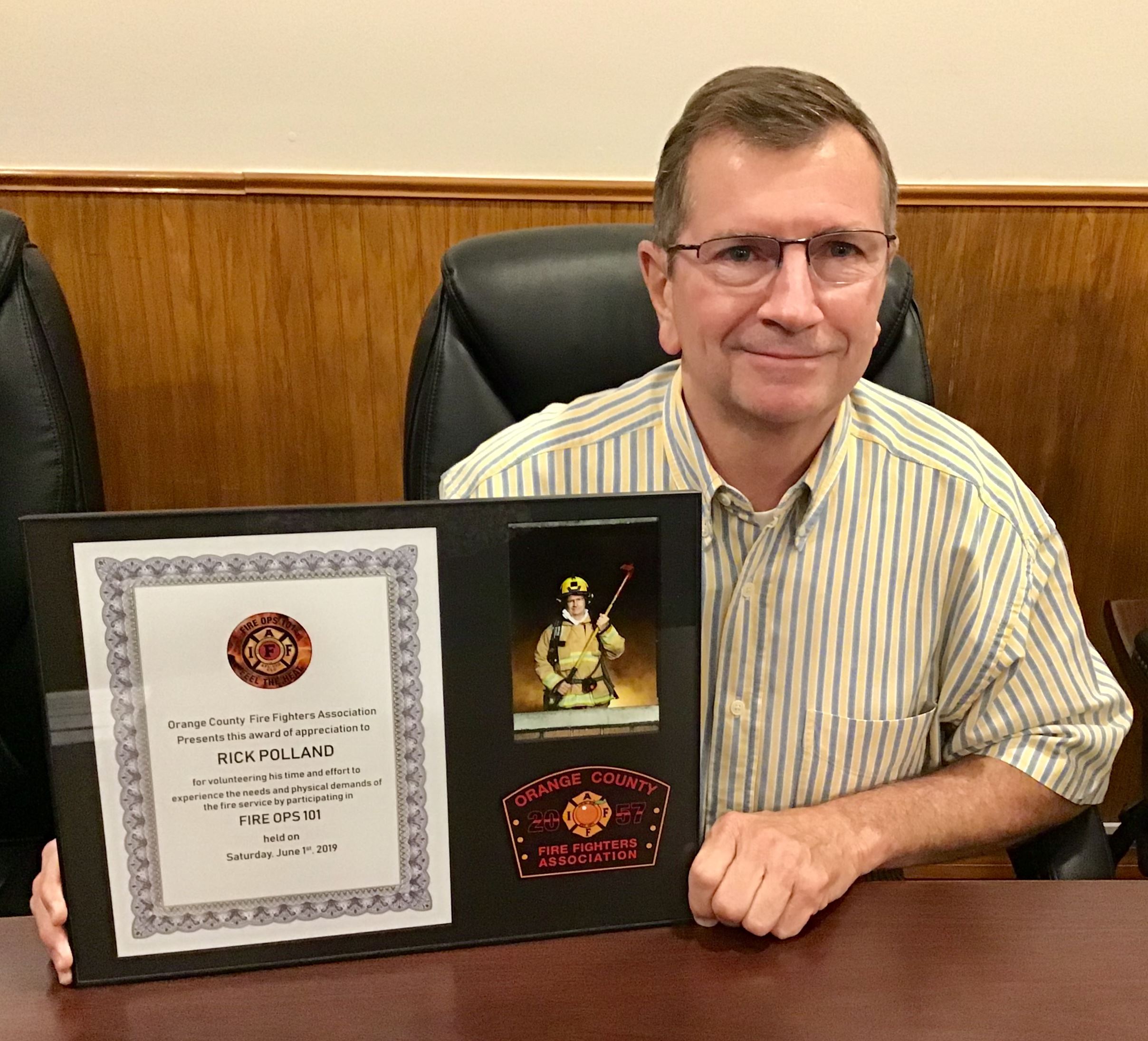 Commissioner Polland with Fire Ops 101 Plaque
