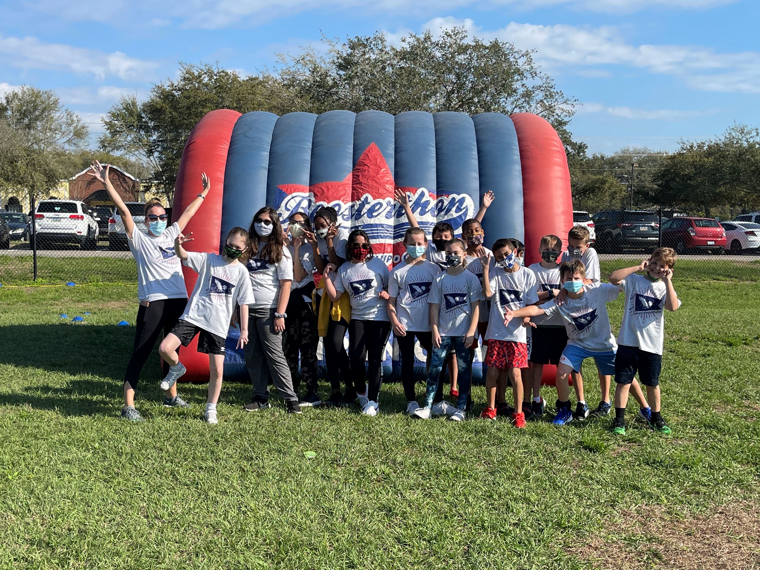 A class of students celebrating in front of the Boosterthon tunnel!